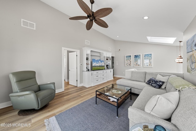 208 E 20th St, Long Beach Twp, NJ 08008 - living area with a skylight, light wood-style floors, high vaulted ceiling, a ceiling fan, and recessed lighting