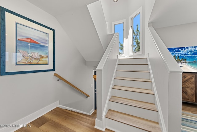 208 E 20th St, Long Beach Twp, NJ 08008 - staircase with baseboards and wood finished floors