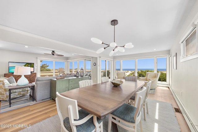 208 E 20th St, Long Beach Twp, NJ 08008 - dining area featuring a chandelier, light wood-style floors, recessed lighting, plenty of natural light, and a ceiling fan