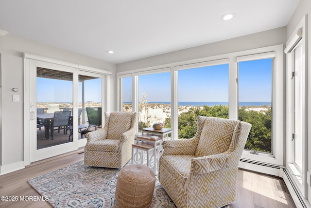 208 E 20th St, Long Beach Twp, NJ 08008 - sunroom with healthy amount of natural light, wood finished floors, recessed lighting, and a water view