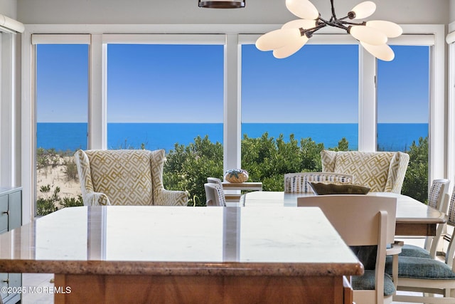 208 E 20th St, Long Beach Twp, NJ 08008 - dining room featuring a water view and a chandelier