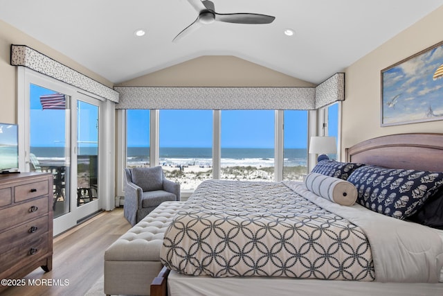 208 E 20th St, Long Beach Twp, NJ 08008 - bedroom with lofted ceiling, view of water and beach, wood finished floors, a baseboard heating unit, and access to exterior