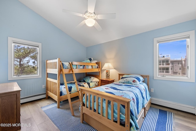 208 E 20th St, Long Beach Twp, NJ 08008 - bedroom featuring a baseboard heating unit, lofted ceiling, light wood-type flooring, and a ceiling fan