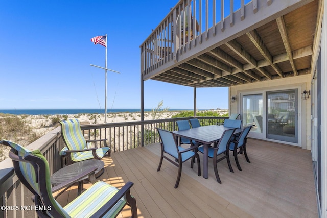 208 E 20th St, Long Beach Twp, NJ 08008 - wooden deck featuring view of water and beach and outdoor dining area