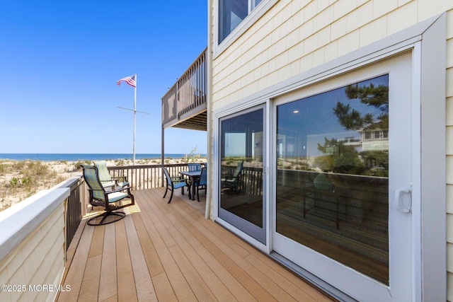 208 E 20th St, Long Beach Twp, NJ 08008 - wooden terrace featuring outdoor dining area and view of water and beach