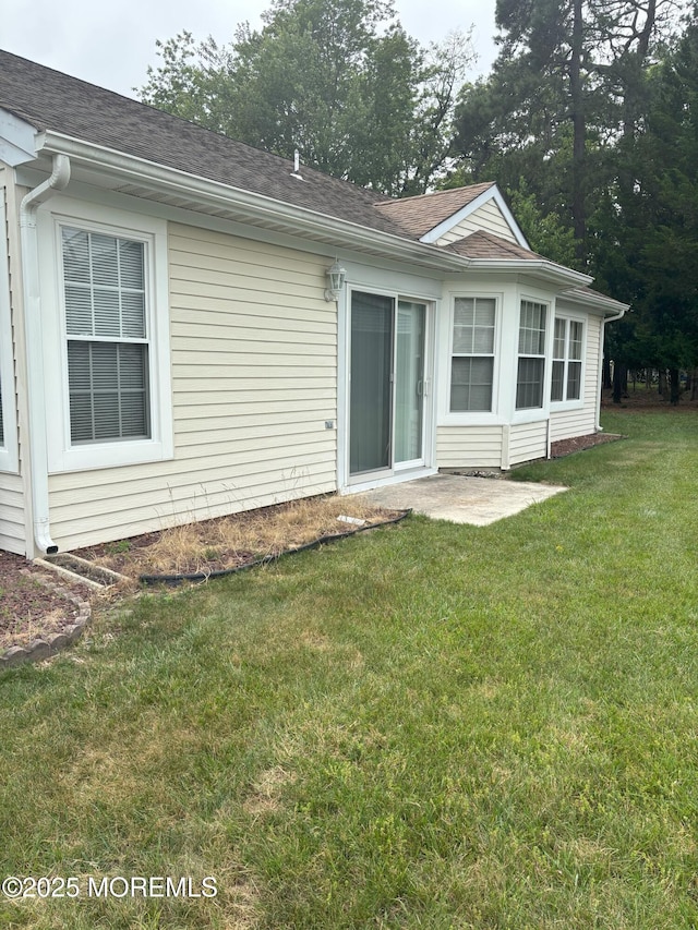 2009 Brookdale Dr, Forked River, NJ 08731 - rear view of property with a yard and a shingled roof