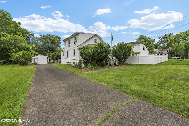 17 Wood Ave, Englishtown, NJ 07726 - view of side of home featuring a shed and asphalt driveway