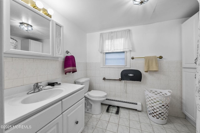 17 Wood Ave, Englishtown, NJ 07726 - bathroom with a baseboard heating unit, vanity, tile walls, tile patterned flooring, and a wainscoted wall