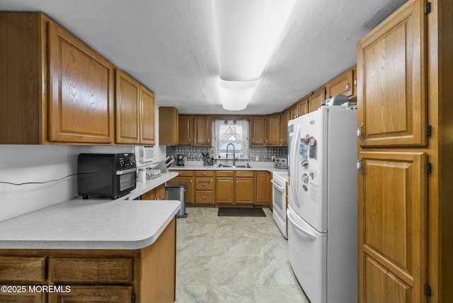 17 Wood Ave, Englishtown, NJ 07726 - kitchen featuring white appliances, light countertops, brown cabinets, backsplash, and a peninsula