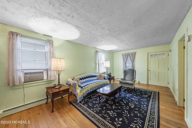 17 Wood Ave, Englishtown, NJ 07726 - living room with a textured ceiling, healthy amount of natural light, wood finished floors, and cooling unit