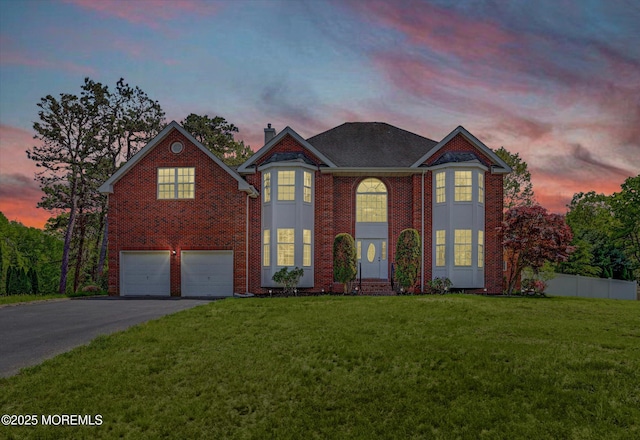 1041 Aumack Rd, Jackson, NJ 08527 - view of front of property featuring a garage, driveway, a chimney, and brick siding