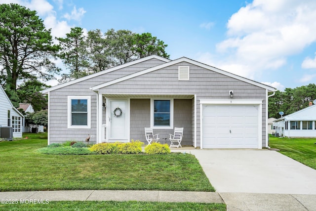 9 Maniwaki Ct, Toms River, NJ 08757 - view of front of home featuring a front lawn, a garage, a porch, and concrete driveway