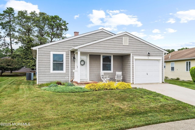 9 Maniwaki Ct, Toms River, NJ 08757 - view of front of home featuring a chimney, a garage, driveway, and a front yard