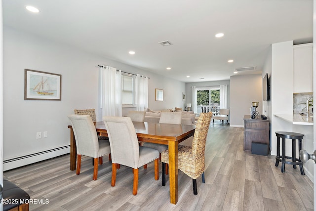 9 Maniwaki Ct, Toms River, NJ 08757 - dining area featuring a baseboard radiator, light wood finished floors, and recessed lighting