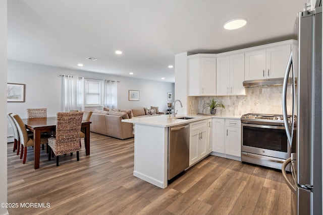 9 Maniwaki Ct, Toms River, NJ 08757 - kitchen featuring appliances with stainless steel finishes, open floor plan, wood finished floors, white cabinets, and recessed lighting