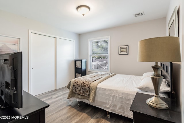 9 Maniwaki Ct, Toms River, NJ 08757 - bedroom with a closet and light wood-style flooring