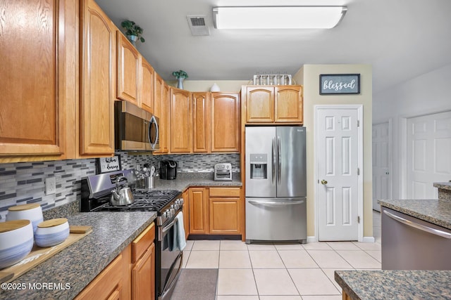 100 Pine St Unit 9, Lakehurst, NJ 08733 - kitchen featuring stainless steel appliances, light tile patterned flooring, and decorative backsplash