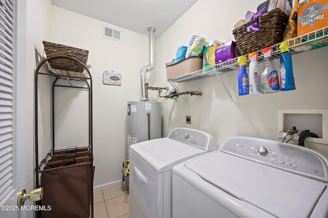 100 Pine St Unit 9, Lakehurst, NJ 08733 - washroom with light tile patterned floors, independent washer and dryer, and gas water heater