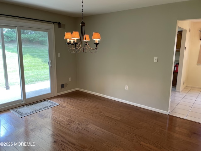 14 Weston Ct, Marlboro, NJ 07746 - unfurnished dining area with a chandelier and wood finished floors