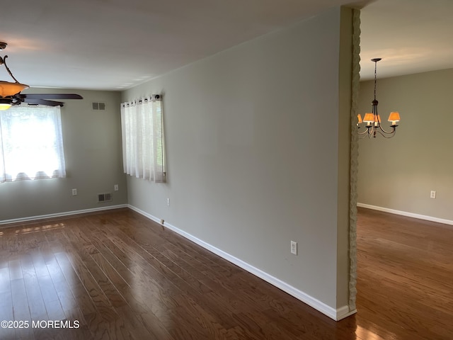 14 Weston Ct, Marlboro, NJ 07746 - unfurnished room with a chandelier, healthy amount of natural light, dark wood-style floors, and ceiling fan