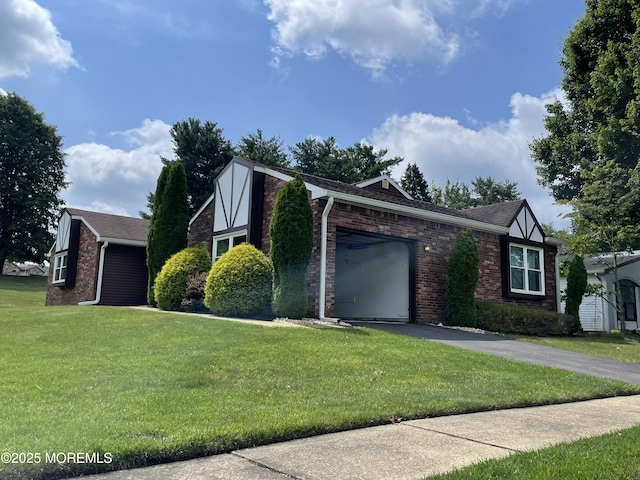 14 Weston Ct, Marlboro, NJ 07746 - tudor house with brick siding, a garage, asphalt driveway, a front lawn, and a shingled roof