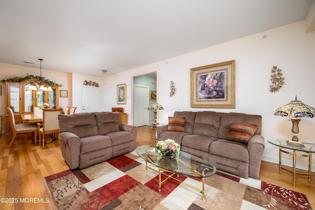 203 Canterbury Ln, Morganville, NJ 07751 - living room with wood finished floors and a chandelier