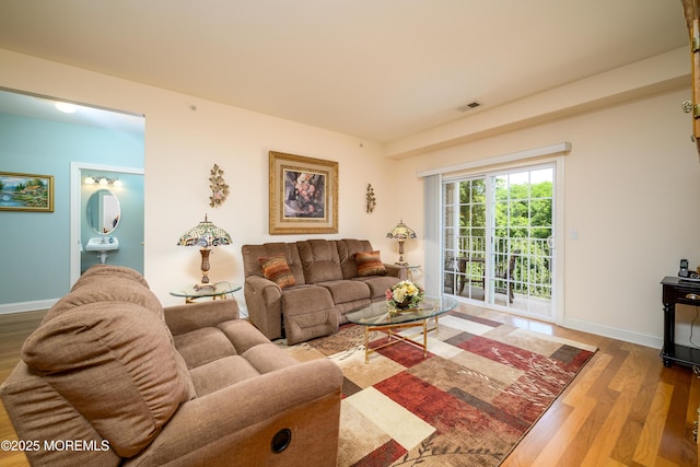 203 Canterbury Ln, Morganville, NJ 07751 - living area with wood finished floors