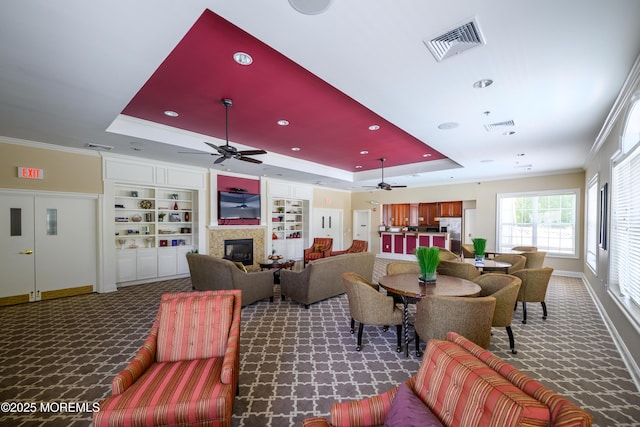203 Canterbury Ln, Morganville, NJ 07751 - living room featuring a ceiling fan, a tray ceiling, carpet floors, ornamental molding, and recessed lighting