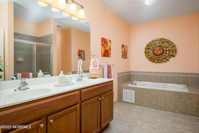 203 Canterbury Ln, Morganville, NJ 07751 - full bathroom featuring tile patterned floors, double vanity, a stall shower, and a garden tub