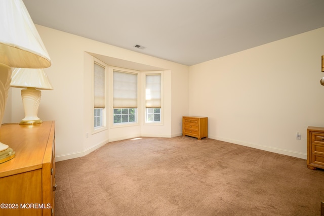 203 Canterbury Ln, Morganville, NJ 07751 - empty room featuring carpet and baseboards