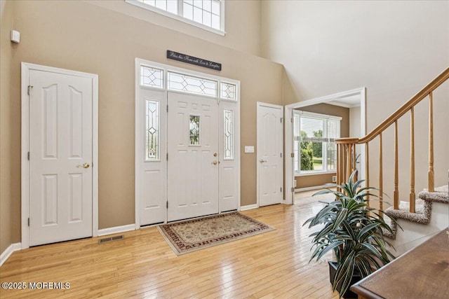 140 Palisade Dr, Freehold, NJ 07728 - foyer featuring hardwood / wood-style flooring, stairs, and a high ceiling
