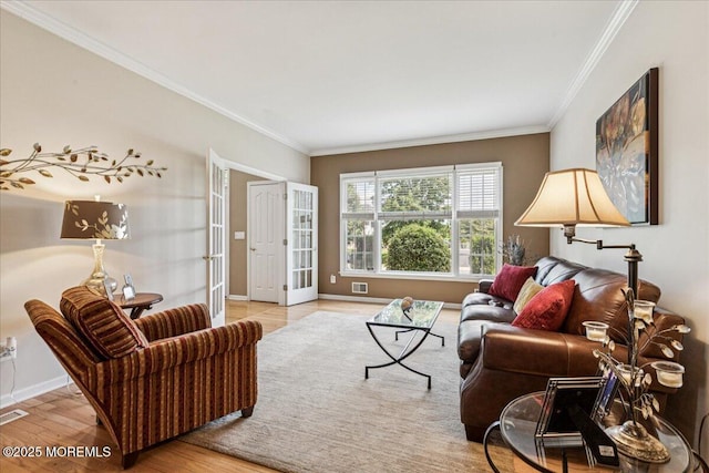 140 Palisade Dr, Freehold, NJ 07728 - living room featuring ornamental molding, french doors, and wood finished floors