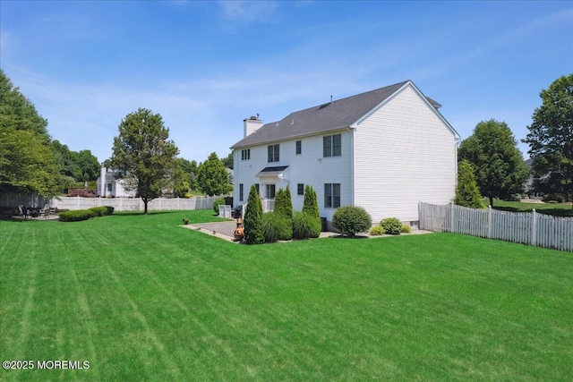140 Palisade Dr, Freehold, NJ 07728 - rear view of house featuring a chimney, a fenced backyard, and a patio area