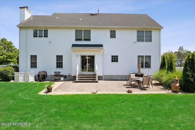 140 Palisade Dr, Freehold, NJ 07728 - rear view of house featuring a chimney, a patio area, a yard, and entry steps
