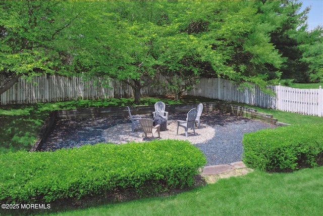 140 Palisade Dr, Freehold, NJ 07728 - fenced backyard featuring an outdoor fire pit and a patio