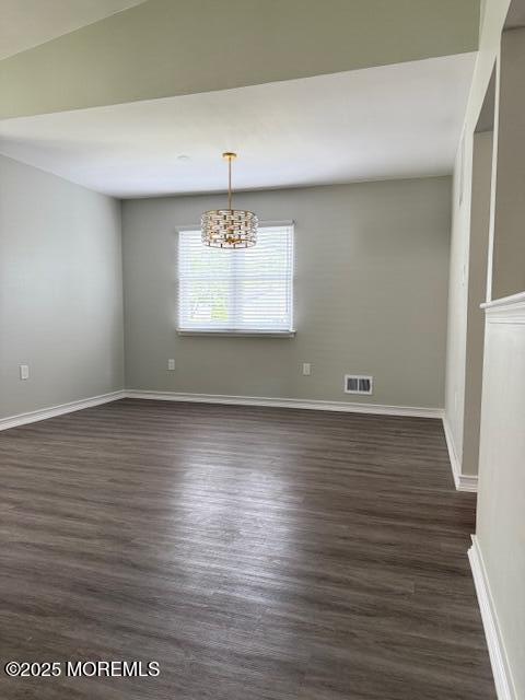11 Ivy Rdg Unit 1000, Howell, NJ 07728 - unfurnished dining area with a chandelier and dark wood finished floors