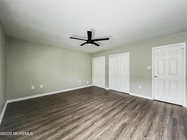11 Ivy Rdg Unit 1000, Howell, NJ 07728 - unfurnished bedroom with multiple closets, dark wood-style flooring, and ceiling fan