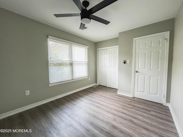11 Ivy Rdg Unit 1000, Howell, NJ 07728 - unfurnished bedroom with wood finished floors, a closet, and ceiling fan