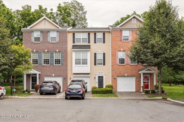 259 Chickadee Ct Unit 1000, Freehold, NJ 07728 - townhome / multi-family property with driveway, a garage, and brick siding