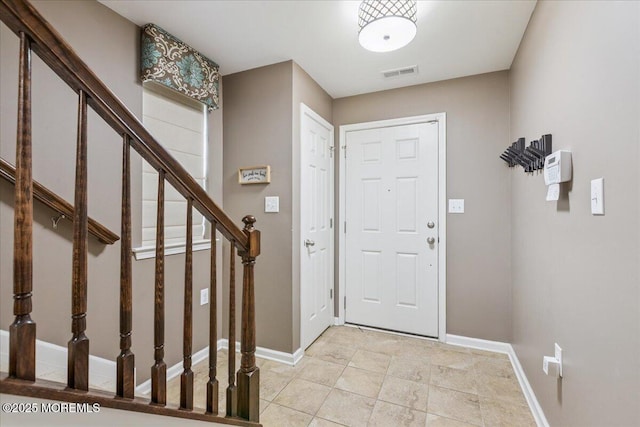 259 Chickadee Ct Unit 1000, Freehold, NJ 07728 - foyer entrance with stairway and light tile patterned floors