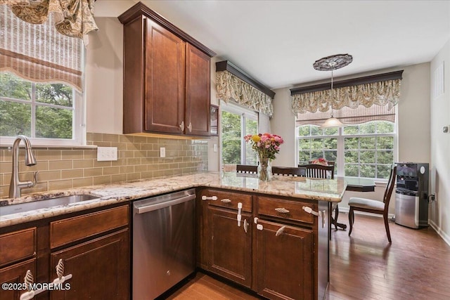 259 Chickadee Ct Unit 1000, Freehold, NJ 07728 - kitchen featuring stainless steel dishwasher, backsplash, light stone counters, and a peninsula