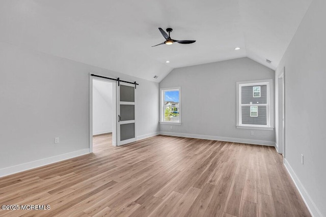 12 Outsail Ave, Barnegat, NJ 08005 - unfurnished room with a barn door, ceiling fan, lofted ceiling, light wood-style flooring, and recessed lighting