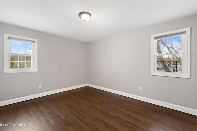 23 Island Dr, Brick, NJ 08724 - spare room featuring healthy amount of natural light and dark wood-style flooring