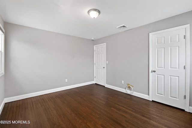 23 Island Dr, Brick, NJ 08724 - unfurnished bedroom featuring baseboards and dark wood-type flooring