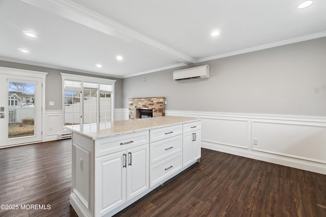 23 Island Dr, Brick, NJ 08724 - kitchen with a wall mounted air conditioner, healthy amount of natural light, dark wood finished floors, ornamental molding, and wainscoting