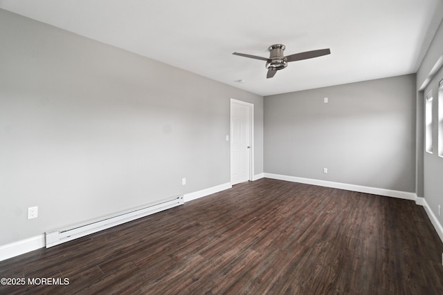23 Island Dr, Brick, NJ 08724 - spare room featuring a baseboard heating unit, dark wood finished floors, and a ceiling fan