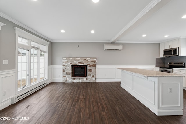 23 Island Dr, Brick, NJ 08724 - unfurnished living room with a wall mounted air conditioner, a baseboard heating unit, a wainscoted wall, a decorative wall, and dark wood-style floors