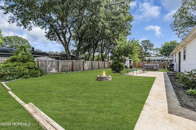 1341 1st Ave, Toms River, NJ 08757 - fenced backyard featuring a fire pit and a patio area