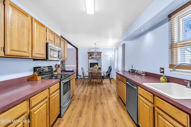 1341 1st Ave, Toms River, NJ 08757 - kitchen with stainless steel appliances, light wood-style floors, and dark countertops