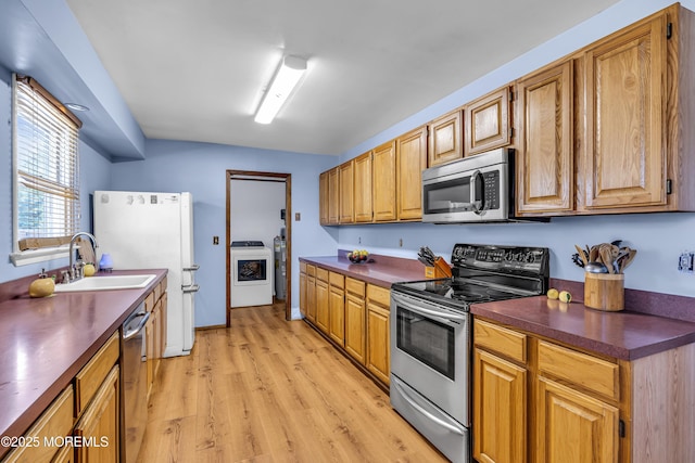 1341 1st Ave, Toms River, NJ 08757 - kitchen featuring stainless steel appliances, dark countertops, and light wood-style floors